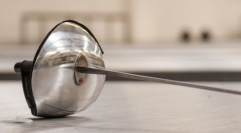 A fencing sabre on the floor