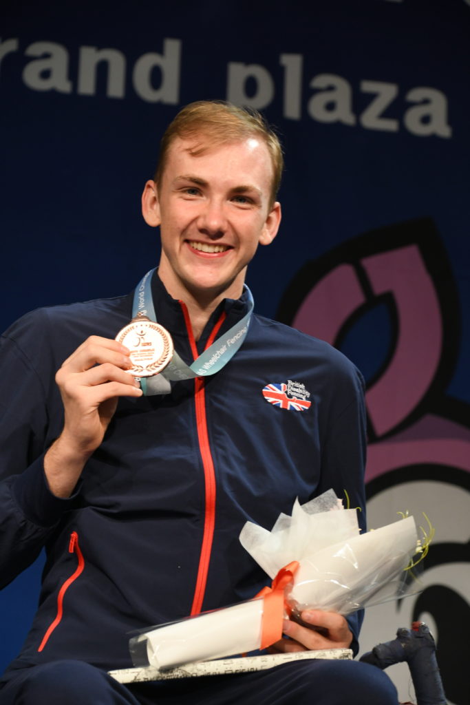 Piers Gilliver holding his gold medal in South Korea Worlds 2019