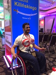 Dimitri with his two medals and two swords presented to the champions