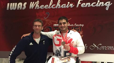 IWAS wheelchair fencing logo with Dmitri Coutya