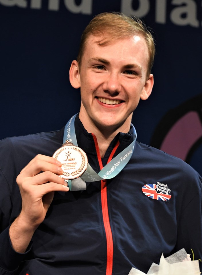 Piers Gilliver smiles with a medal