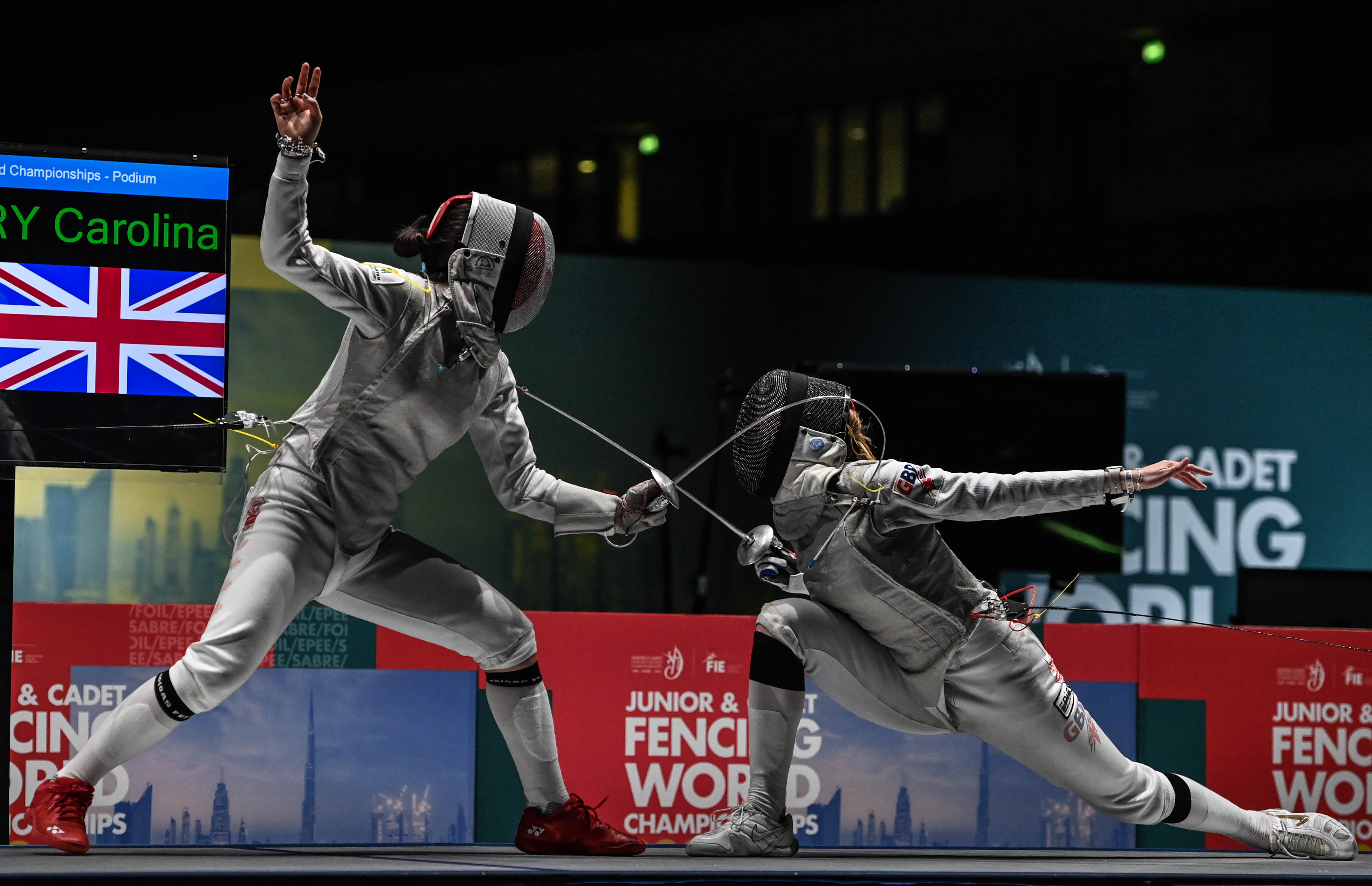 Stutchbury fencing against Guo from Canada in the final of the Cadet women's foil event in Dubai, 2022