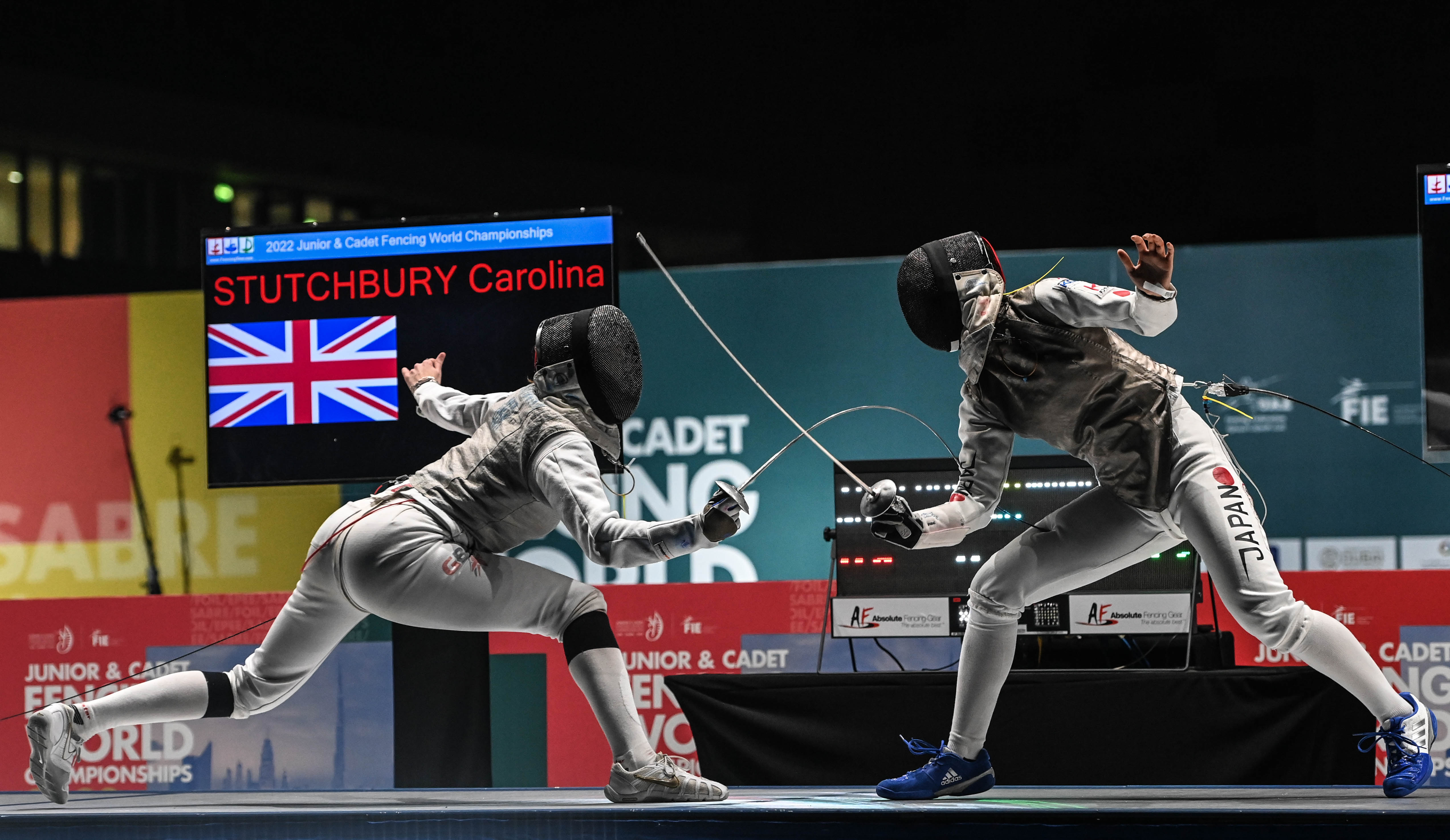 Stutchbury fences against Nagase from Japan in the semi finals of the Cadet women's foil event in Dubai 2022