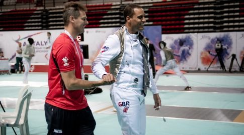 GB Foil Coach Richard Kruse is congratulating James Andrew Davis as they walk off the piste