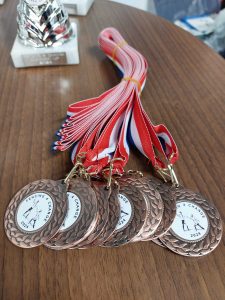 Medals on a table, they say Change Foundation