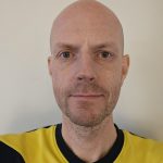A headshot of Chris Buxton 