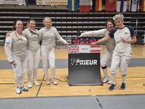 Foil team smiling at camera