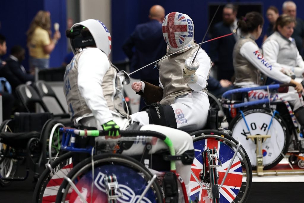 Two para foil fencers in action, one representing GBR and the other USA