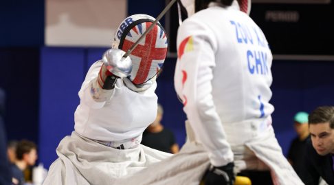 Two para epee fencers in action, one representing GBR and the other CHN.