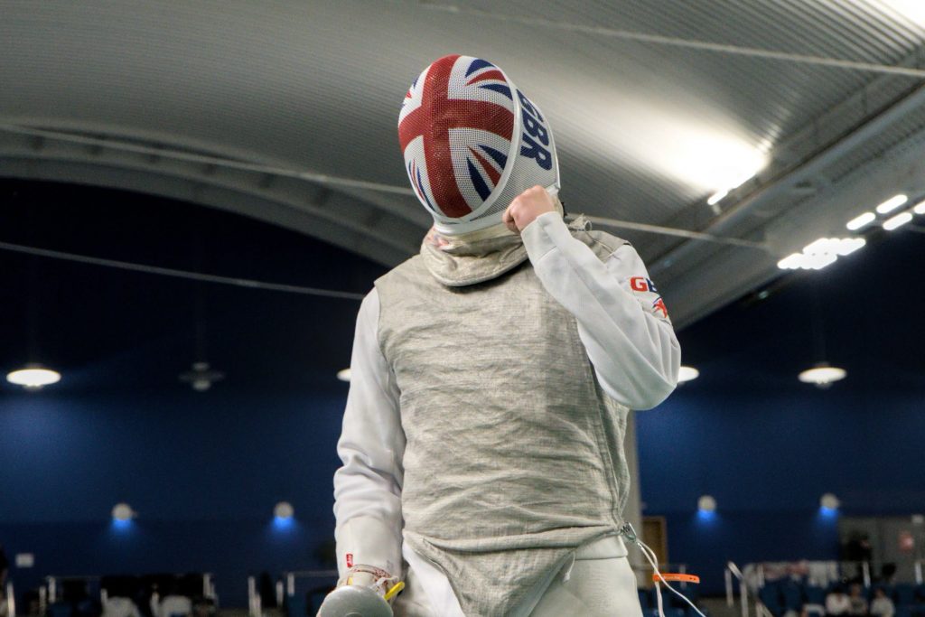 A GBR foil fencer celebrates a point